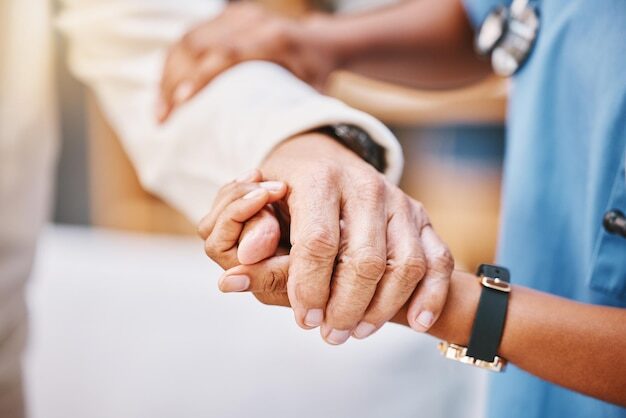 Nurse hands and helping patient with walking rehabilitation and elderly care in clinic Closeup caregiver nursing home and support of holding hands for healthcare safety medical service and trust